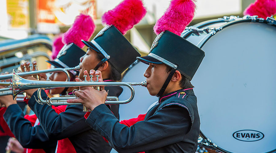 Boy in Marching Band Uniform Playing Trumpet